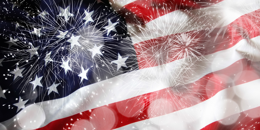 american flag with fireworks and bokeh